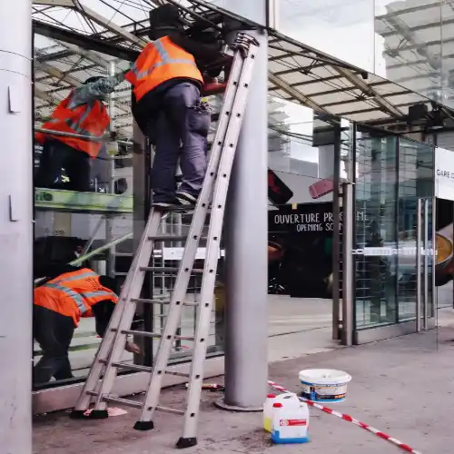 Worker Using a ladder incorrectly
